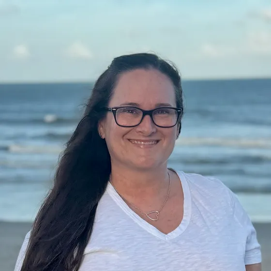 Meredith Galvin, PMHNP-BC, smiling on the beach